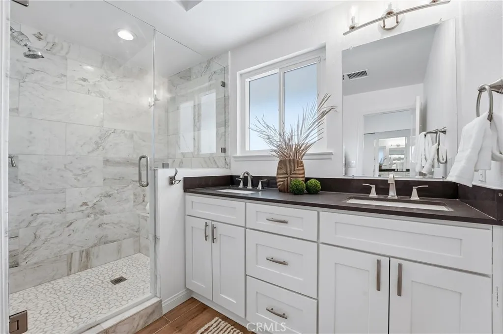 Remodeled Primary Bathroom with Walk In Shower