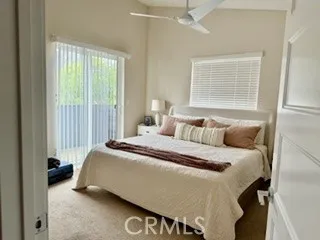 Primary bedroom with deck outside of slider