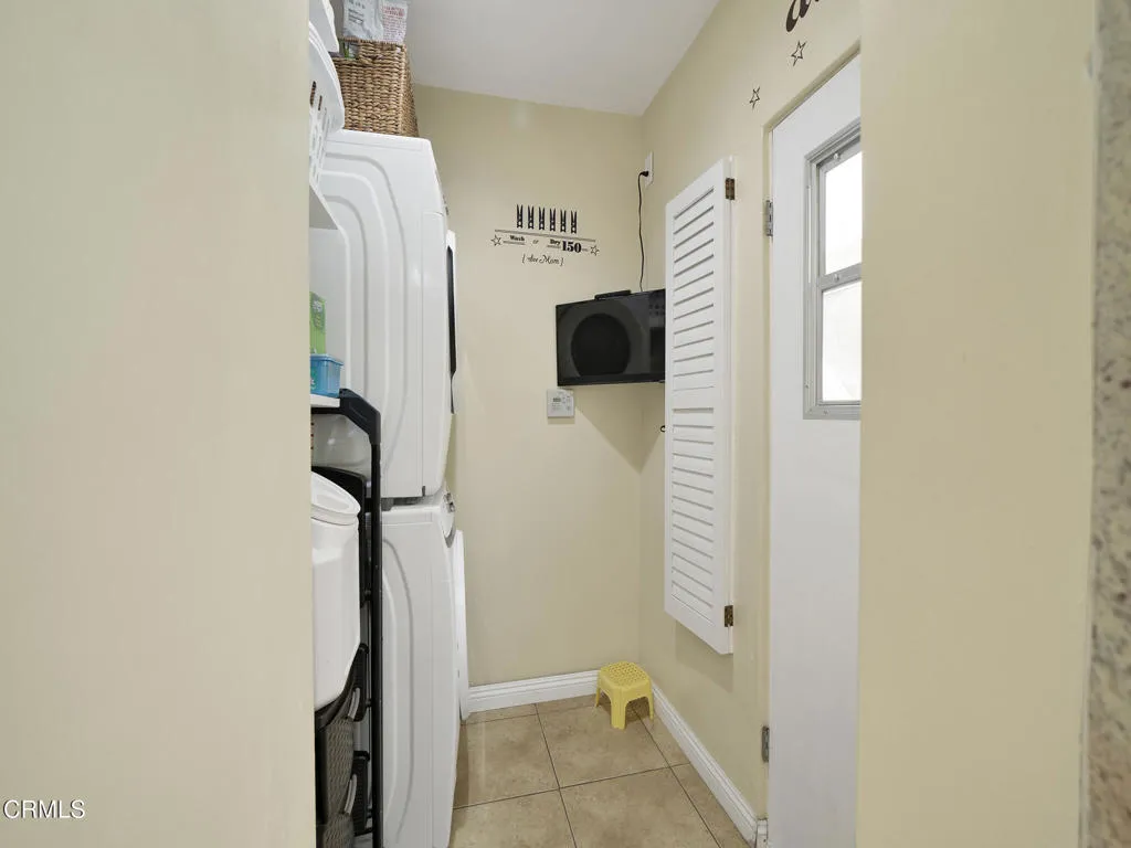 Laundry room with TV