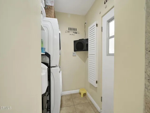 Laundry room with TV
