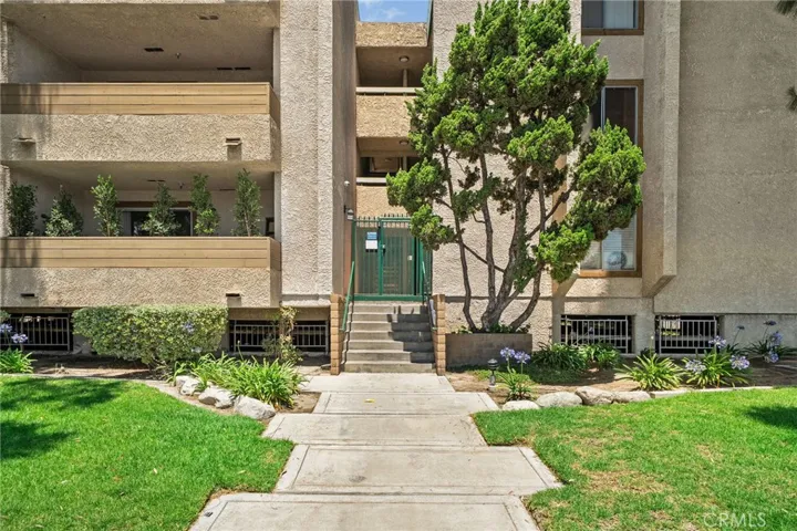 Front of building, steps up to gate, unit is 2nd on the right upon entering
