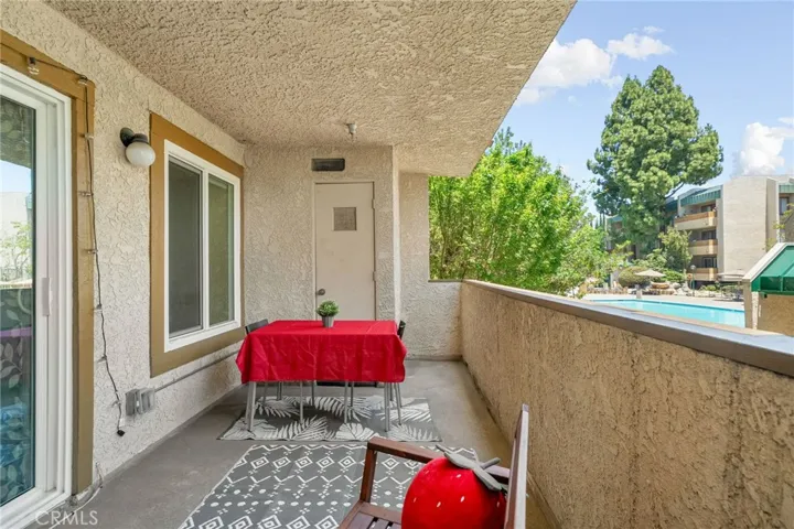 Balcony with view of pool