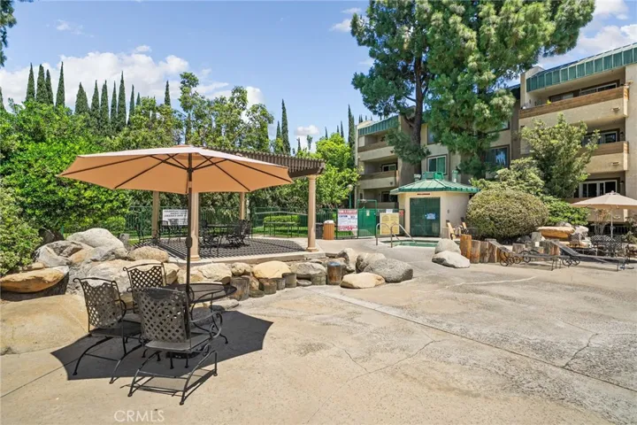 Outside pool area, jacuzzi and barbeque area