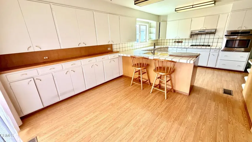 KITCHEN STORAGE AND DINING AREA