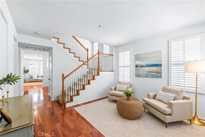 A charming light-filled welcome lounge greets you upon entry, featuring wood flooring, bright white interior, plantation shutters and beautiful wall-to-wall windows.