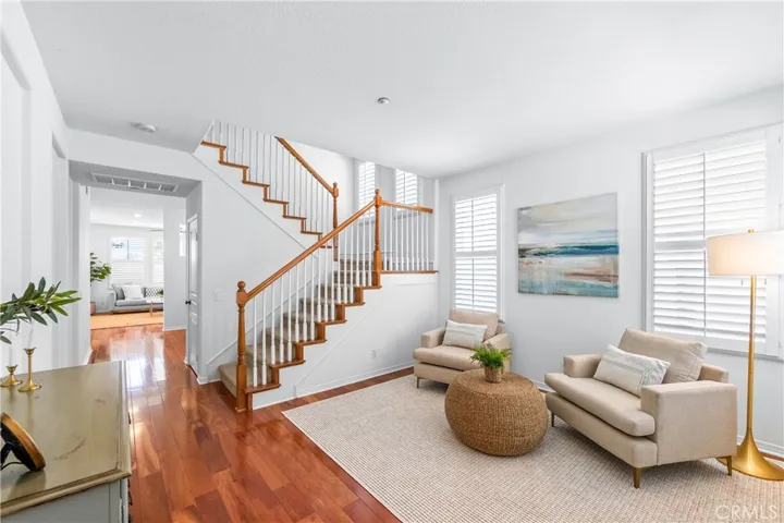 A charming light-filled welcome lounge greets you upon entry, featuring wood flooring, bright white interior, plantation shutters and beautiful wall-to-wall windows.