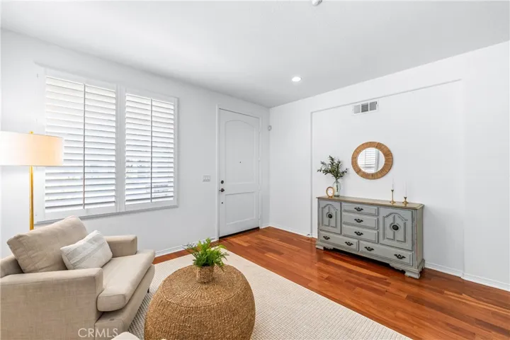 A charming light-filled welcome lounge greets you upon entry, featuring wood flooring, bright white interior, plantation shutters and beautiful wall-to-wall windows.
