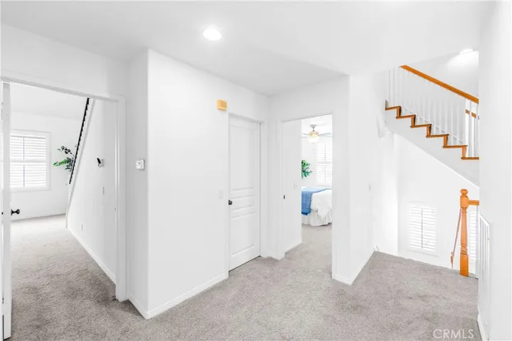 Hall transition to primary bedroom and bedroom #4