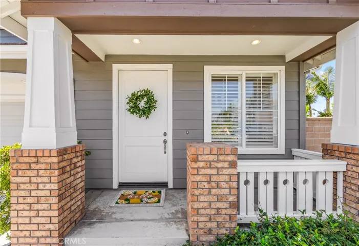 Elegant coastal living in a gated community, less than 1 mile to the beach. Timeless curb appeal.