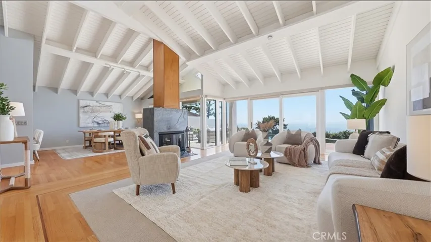 living room opens to dining room and kitchen
