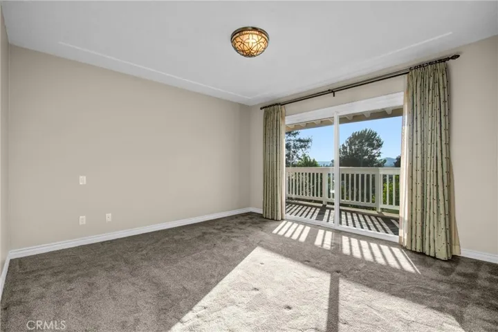 main level master with slider to balcony and deck