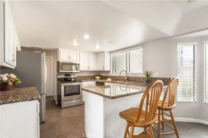 lLight and bright kitchen with granite counters