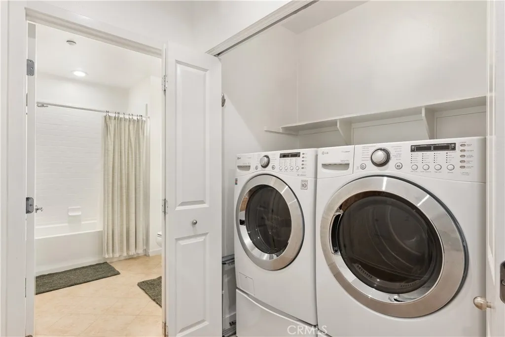 Dedicated laundry area with full size washer and dryer for added convenience.