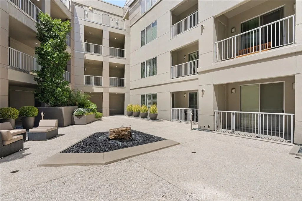 Resort style courtyard offering a peaceful and beautifully maintained community setting.