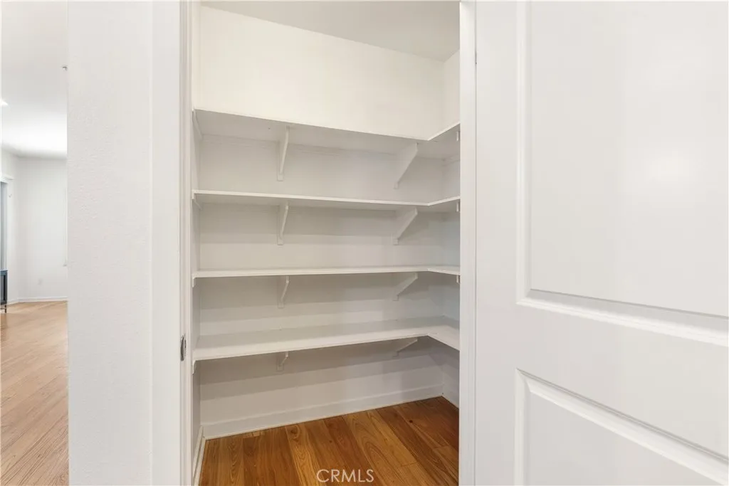 Walk in pantry offering exceptional kitchen storage and everyday convenience.