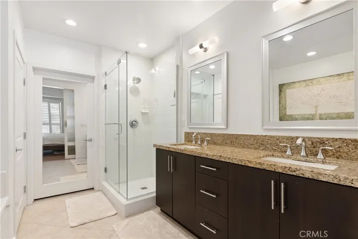 Beautifully appointed primary bath with oversized vanity and elegant finishes throughout.