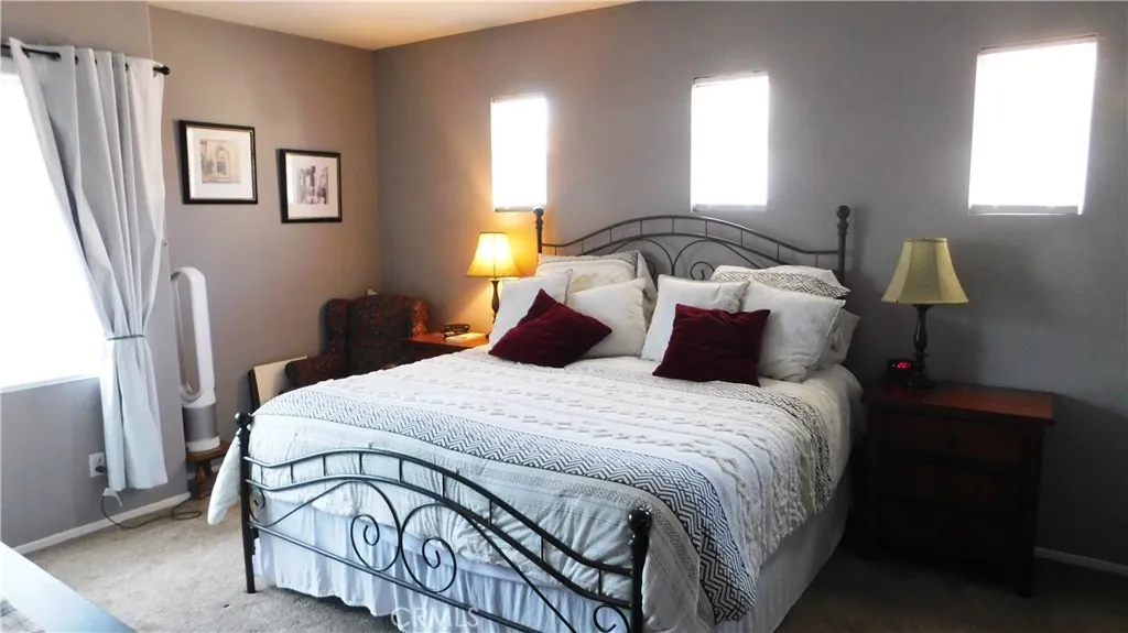 The Primary suite is light and bright with walk-in closet
