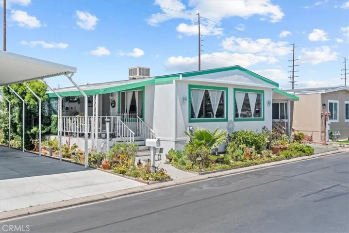 Front of house, new exterior paint, beautiful well-maintained landscape
