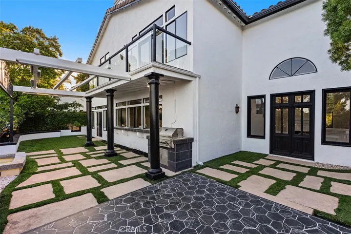 Low maintenance , high-end backyard made for entertainment