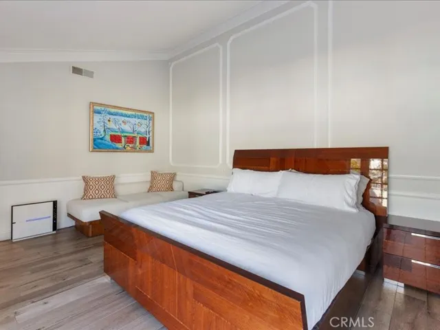Primary bedroom with large walk-in closet behind far wall.