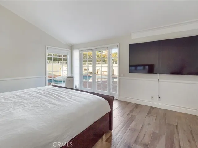 Primary bedroom facing towards the private pool and spa in the yard