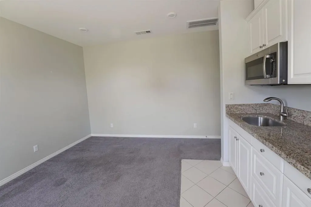 Separate In-Law Suite Family Room with private side entry and code door