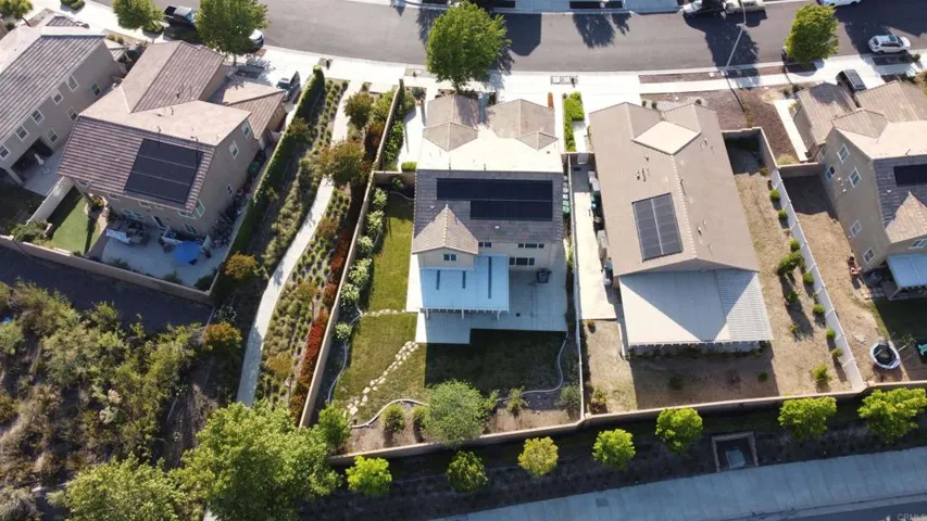 Drone photo of top of home with surrounding areas