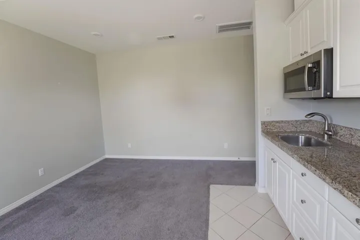 Separate In-Law Suite Family Room with private side entry and code door