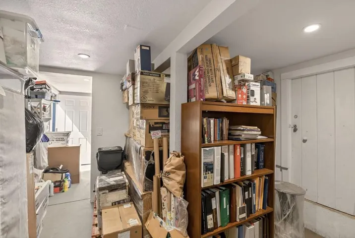 Portion of additional finished storage area behind laundry