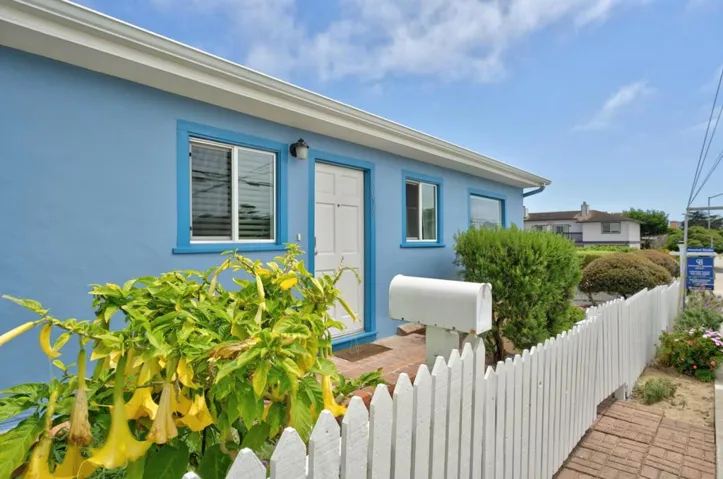 Here's your home with the white picket fence. Sharp curb appeal with fresh exterior and fence paint