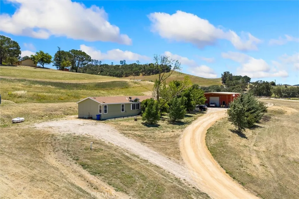 Driveway leading up to the manufactured home and commercial building