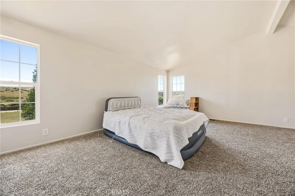 Spacious primary bedroom with two walk in closets