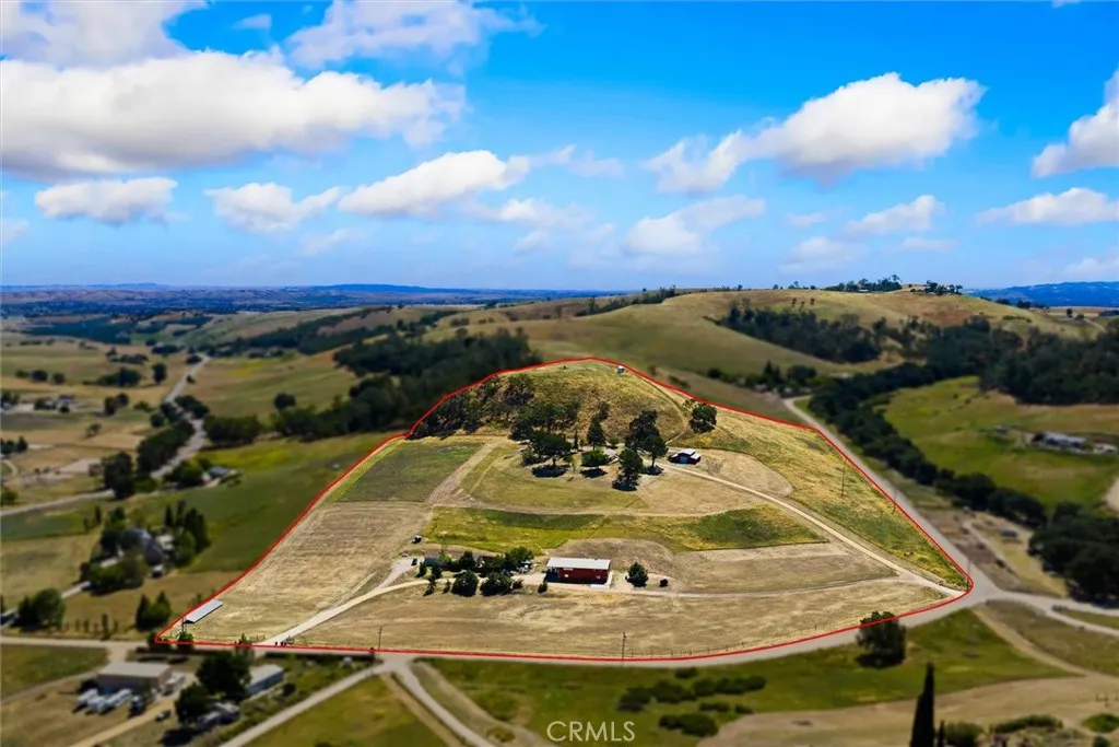 Stunning 26 acres with two homes, commercial building and barn