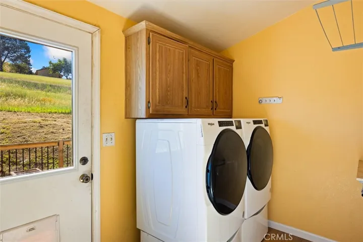 Laundry room next to the kitchen with access to a beautiful back deck