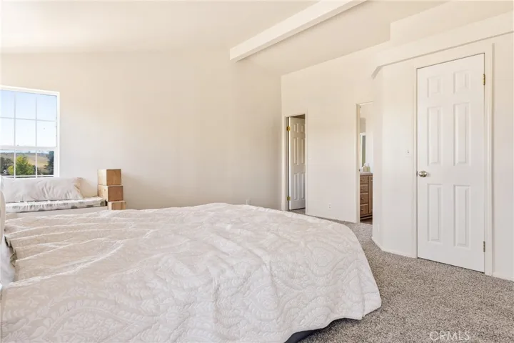 Primary bedroom with two walk in closets and en suite bathroom