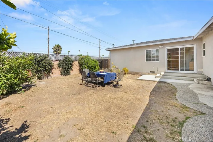 Another angle of the backyard, showing the slider entry to the Dining Room and Kitchen.