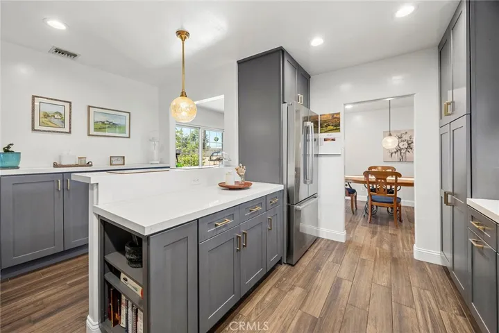 Another angle of the Kithchen from the stove looking at the countertop and into the Dining Room.