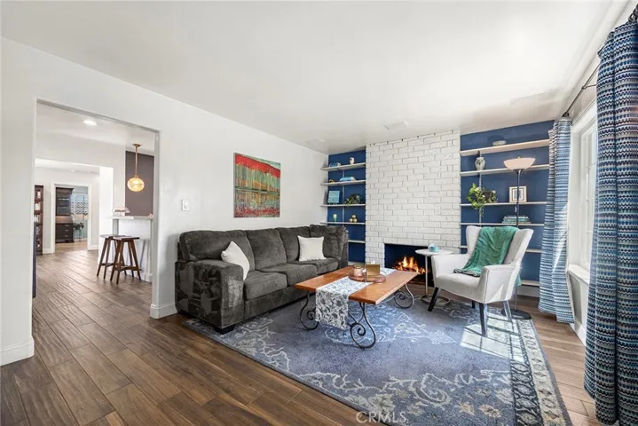 Cozy Living Room with fireplace and built-in shelves.
