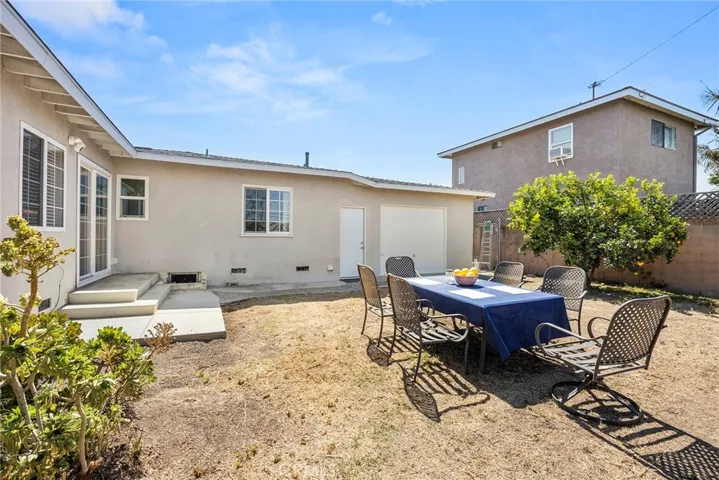 Backyard is a blank slate with endless possibilities to make your vision come to life! Meyer lemon tree on right.