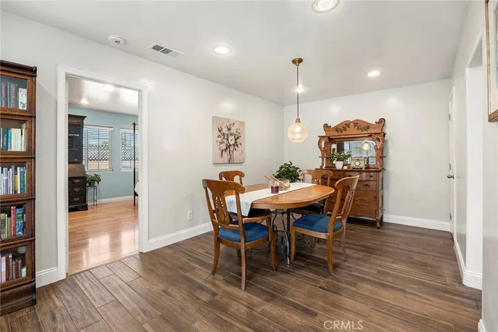 Dining Room and looking into primary suite. Room for a home office where the photographer is shooting from.