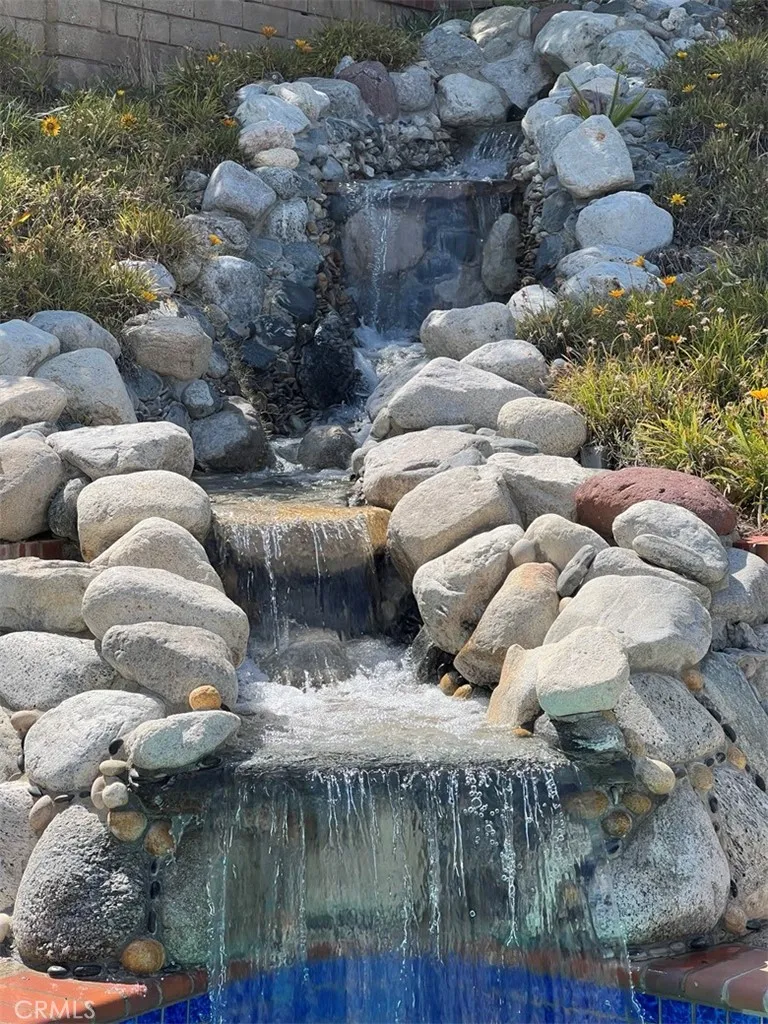 Soothing waterfall into Pool