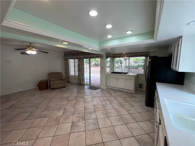 Kitchen to den. Coffered ceiling with can lights