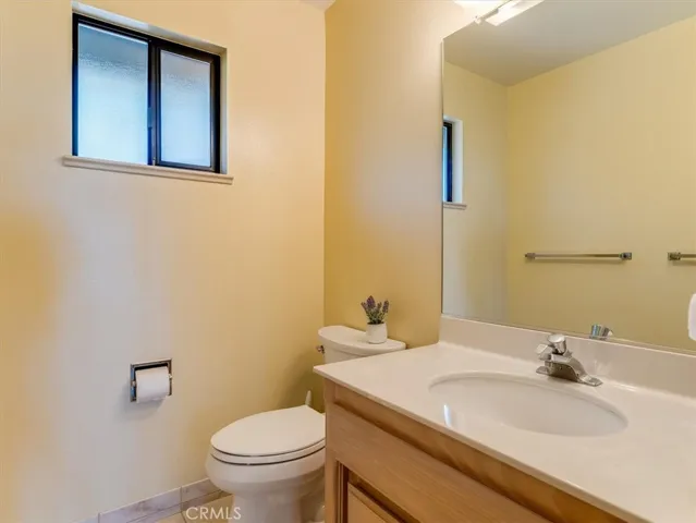 Guest bathroom next to living room.