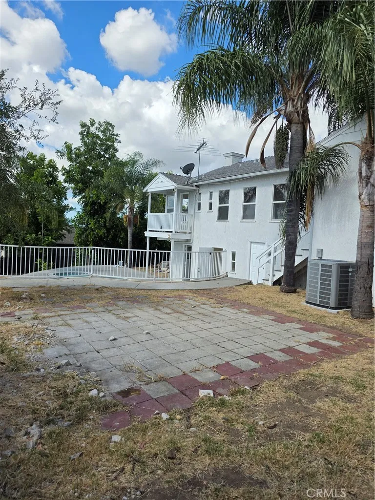 Rear view of home from patio area above pool