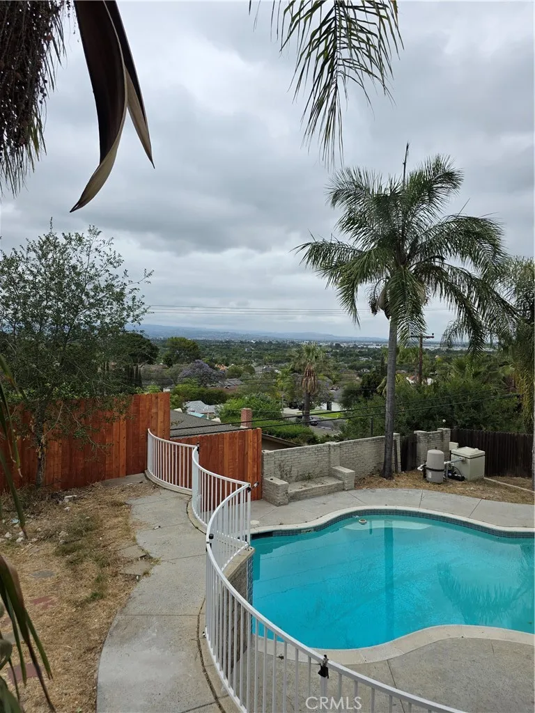 VIEW OF CITY, MOUNTAIN, POOL BELOW FROM BACK DOOR