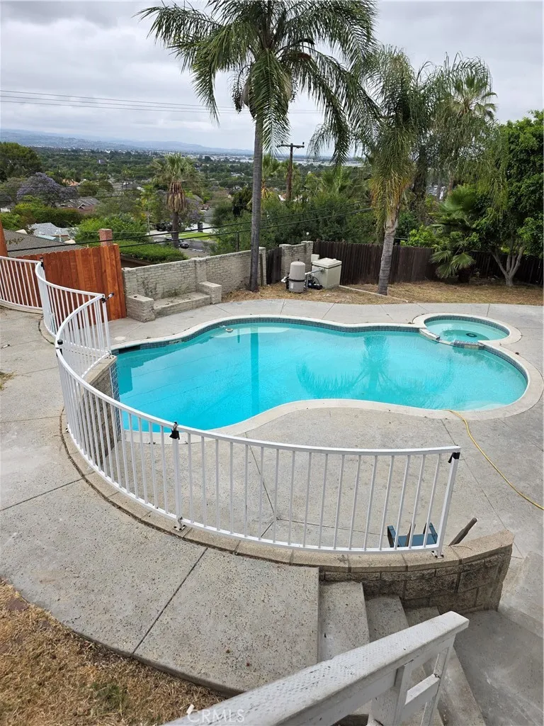 VIEW OF POOL AND PATIO AREA FROM 3RD BEDROOM