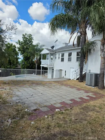 Rear view of home from patio area above pool