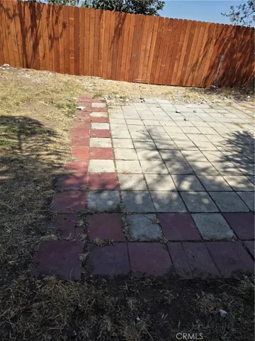PATIO AREA ABOVE POOL IN BACK YARD