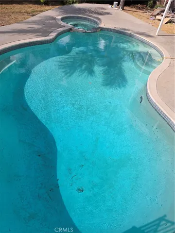 View of pool from patio above