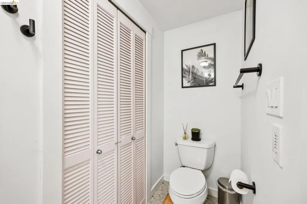 White louvered bifold doors with chrome hardware